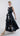 Side view of Psophía poplin dress showing layered ruffle skirt and flowing silhouette.