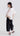 Back view of Psophía relaxed-fit bomber jacket highlighting decorative shoulder seams and relaxed fit