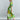 Psophía SS26 Bloomlight long shirt dress with watercolor print in green and yellow tones, featuring a self-tie belt and fluid drape