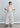 Styled look of Camelia embroidered puff-sleeve blouse paired with tailored trousers for a contemporary elegant outfit.