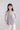 Front view of flared sleeveless mercerized cotton T-shirt featuring a rounded neckline and gently curved hem.