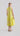 Flash Lemon sleeveless peplum dress shown from the back, revealing round neckline and flowing peplum hem.