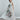 Women’s muted peony print fluid dress styled in relaxed silhouette with handkerchief hem and soft movement