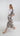 Side view of Retro Bloomleaf long dress highlighting flowing silhouette and short sleeve movement.