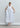 Sleeveless mercerized cotton midi dress with clean silhouette and sculptural rosette detail for refined contemporary elegance.