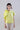 Front view of wide mercerized cotton T-shirt featuring short sleeves, soft luminosity, and sculptural rosette on the shoulder.