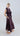 Side view of the fig taffeta palazzo showing structured drape, subtle sheen and fluid movement.