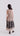 Back view of sleeveless V-neck dress with flowing A-line skirt and symmetrical floral appliqué detailing